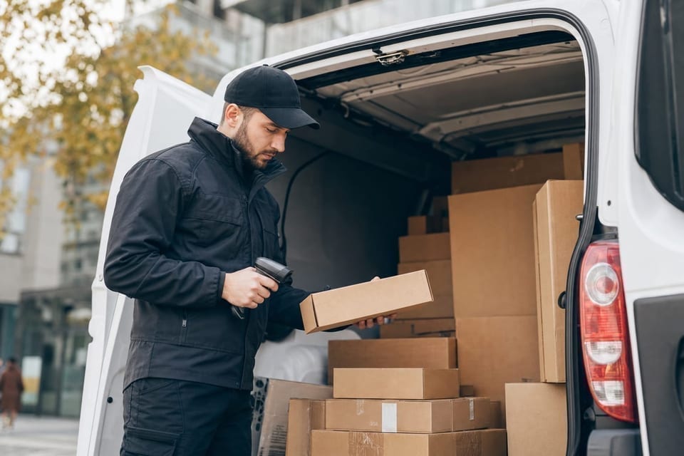 LastMile logistics worker scanning a parcel